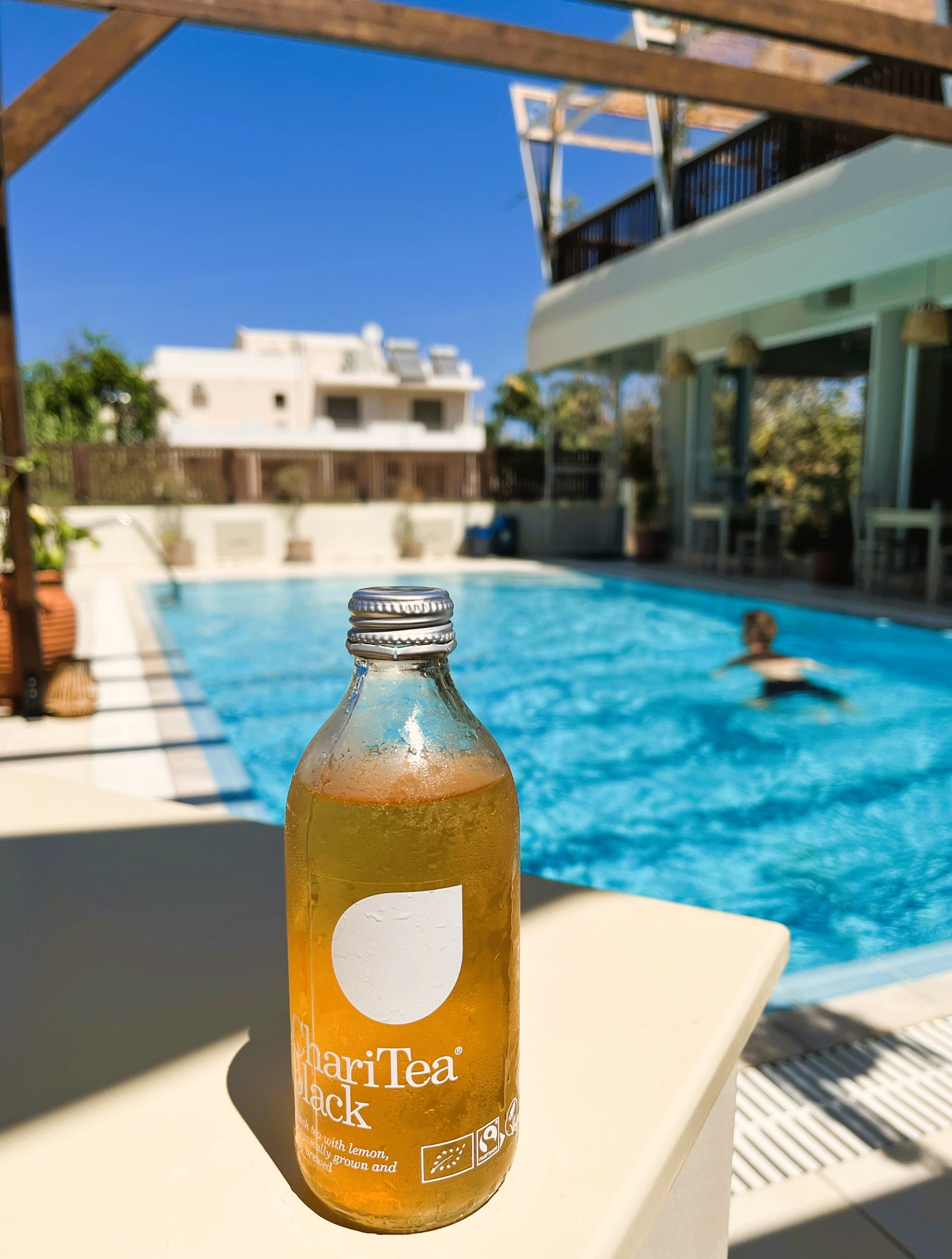 ChariTea - enjoying iced tea by the pool on a sunny day.