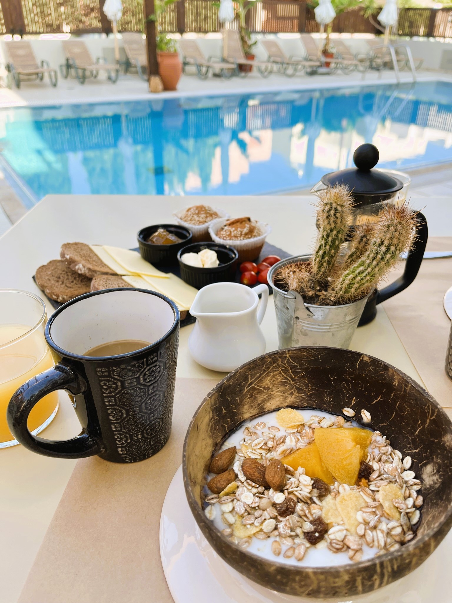 breakfast by the poolside at Goji Vegan Hotel